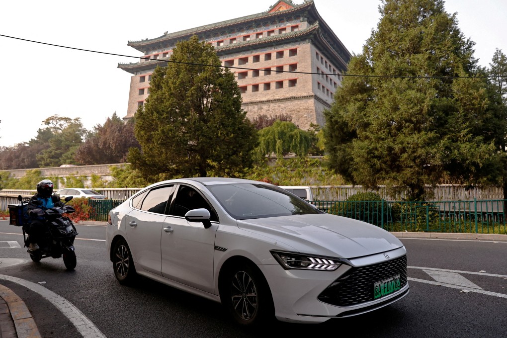An electric vehicle from Chinese manufacturer BYD drives along a street in Beijing. For China to avoid overcapacity there must be sufficient final demand for new advanced manufactured goods. Photo: Reuters