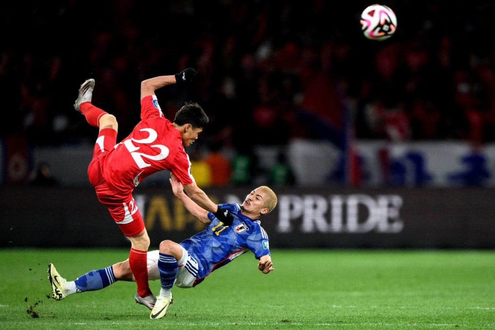 North Korea’s Kim Kuk Bom (left) clashes with Japan’s Daizen Maeda in their World Cup 2026 qualifier in Tokyo on Thursday that the hosts won 1-0. Photo: AFP