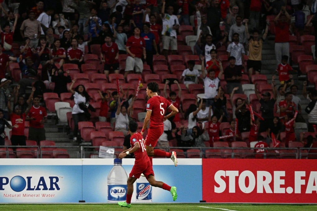 Jacob Mahler (right) celebrates scoring his side’s equaliser against China in their 2026 Fifa World Cup qualifier at the National Stadium. Photo: Xinhua