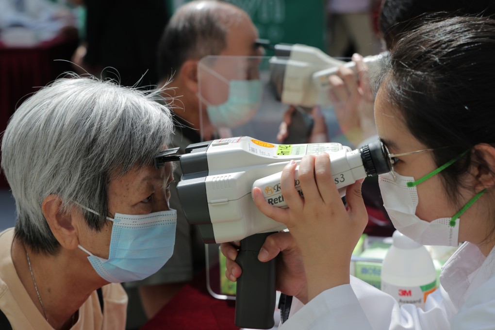 A visitor gets her eyes checked at a health event. Publicly funded comprehensive eye screenings are not widely available in Hong Kong at present. Photo: Jelly Tse