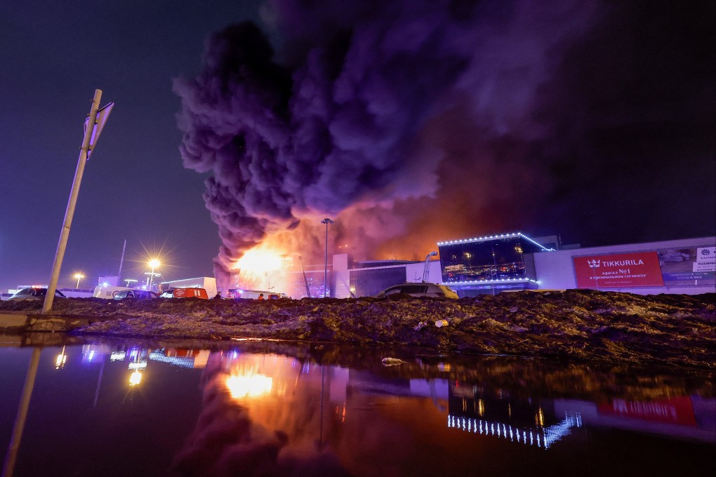 Smoke from fire rises above the burning Crocus City Hall concert venue following a shooting outside Moscow on Friday. Photo: Reuters