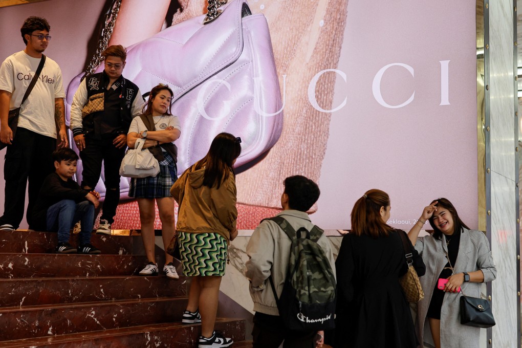 People queue outside a Gucci store in Tsim Sha Tsui, a bustling shopping hotspot in Hong Kong in December 5, 2023. Photo: Reuters