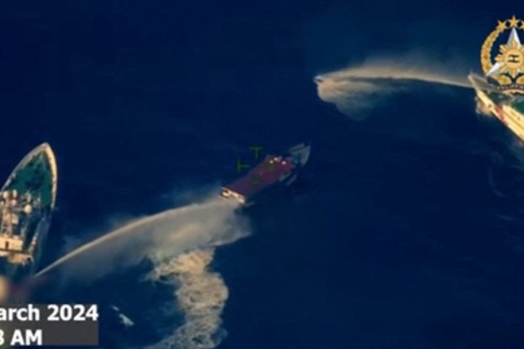 Frame grab from aerial video footage taken by the Philippine military shows Chinese coastguard ships deploying water cannon against a Philippine boat near the Second Thomas Shoal. Photo: AFP