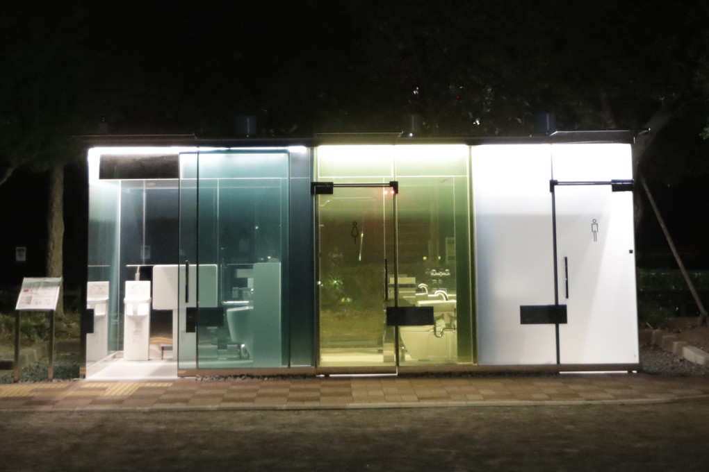 A man uses a transparent toilet that has turned opaque (right) after the door is locked at Haru-no-Owaga Community Park in Tokyo. The so-called transparent toilets were designed by award-winning Japanese architect Shigeru Ban. Photo: AP