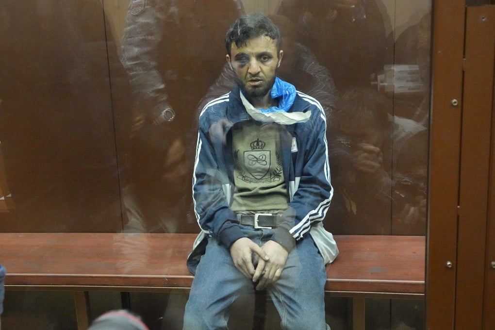 Dalerdzhon Mirzoyev, a suspect in Friday’s Crocus City Hall shooting, sits in a glass cage in the Basmanny District Court in Moscow, Russia on Sunday. Photo: AP