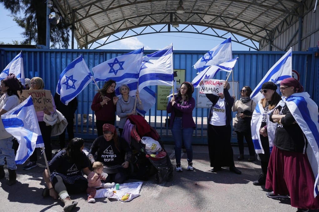 Israelis block the entrance to UNWRA, the main UN agency providing aid in Gaza, during a protest in Jerusalem. Photo: AP
