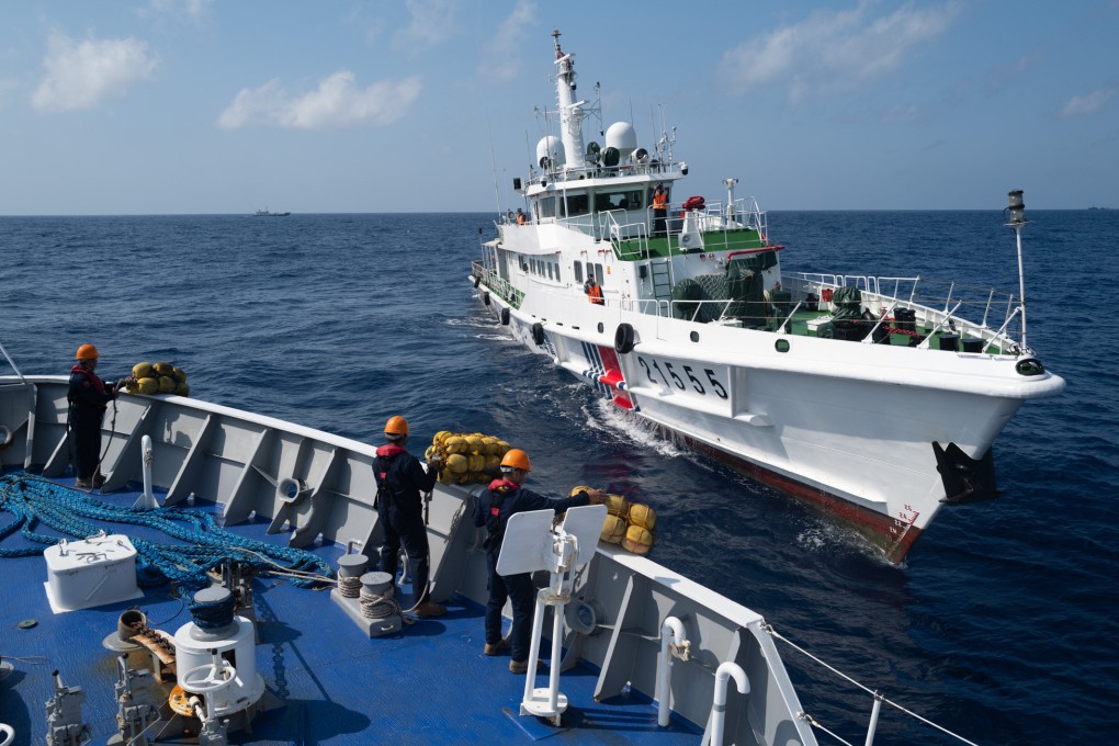 Chinese Coast Guard vessels  water cannoned the civilian supply boat Unaizah May 4 on March 23 during a regular resupply mission at Ayungin Shoal. Photo: Jeoffrey Maitem