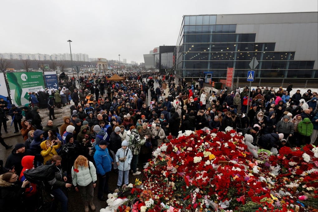 People gather at a makeshift memorial to the victims of Friday’s attack, outside the Crocus City Hall in Moscow. Photo: Reuters