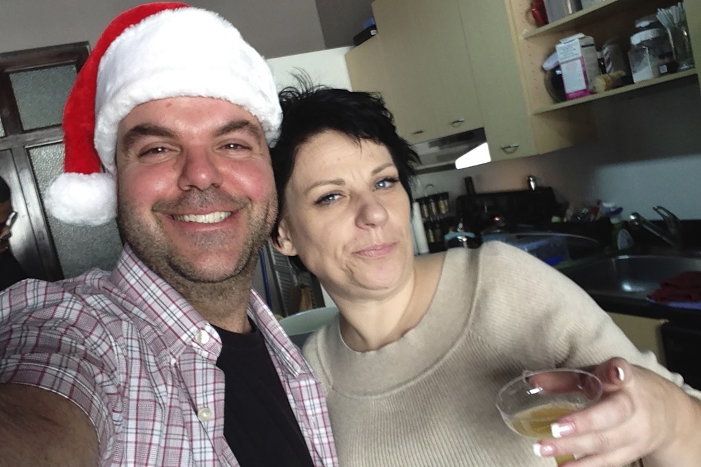 Johnathan Walton and Marianne Smyth pose for a selfie at her tree trimming Christmas party in downtown Los Angeles. Photo: Johnathan Walton via AP