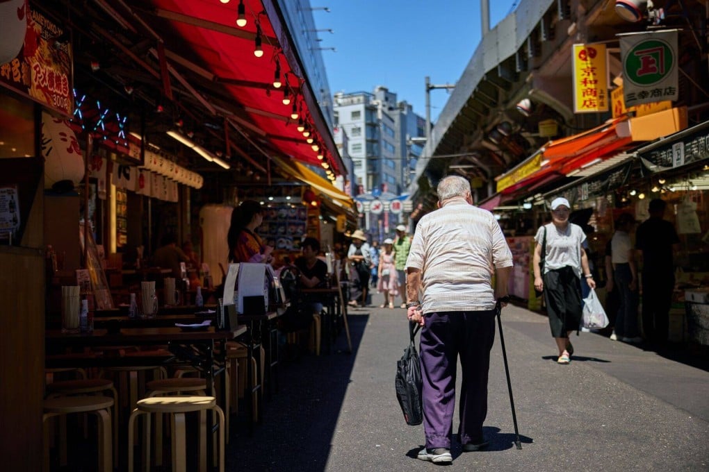 An elderly man walks through the Ueno area of Tokyo, Japan. Photo: Bloomberg