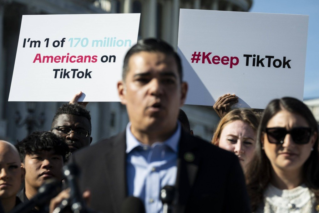 TikTok creators hold signs behind Representative Robert Garcia, a Democrat from California, during a news conference outside the US Capitol in Washington on March 12. Renewed efforts by Congress to force TikTok to sell or face a ban in the US have the backing of the White House, even as President Joe Biden’s reelection campaign has started to use the platform to reach younger voters. Photo: Bloomberg