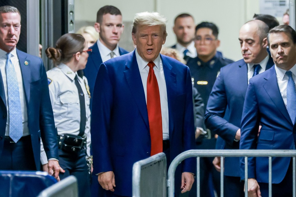 Former US president Donald Trump, centre, arrives for the start of a hearing at New York Criminal Court on Monday. Photo: EPA-EFE