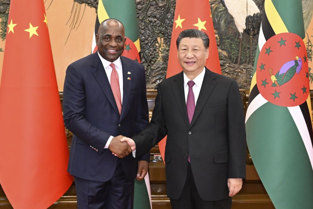 Dominican Prime Minister Roosevelt Skerrit is welcomed to the Great Hall of the People in Beijing by Chinese President Xi Jinping on Monday. Photo: EPA