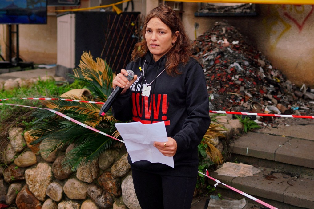 Released hostage Amit Soussana, kidnapped during the October 7 Hamas attack on Israel, in front of her destroyed home at the Kibbutz Kfar Aza, Israel, on January 29. Photo: Reuters