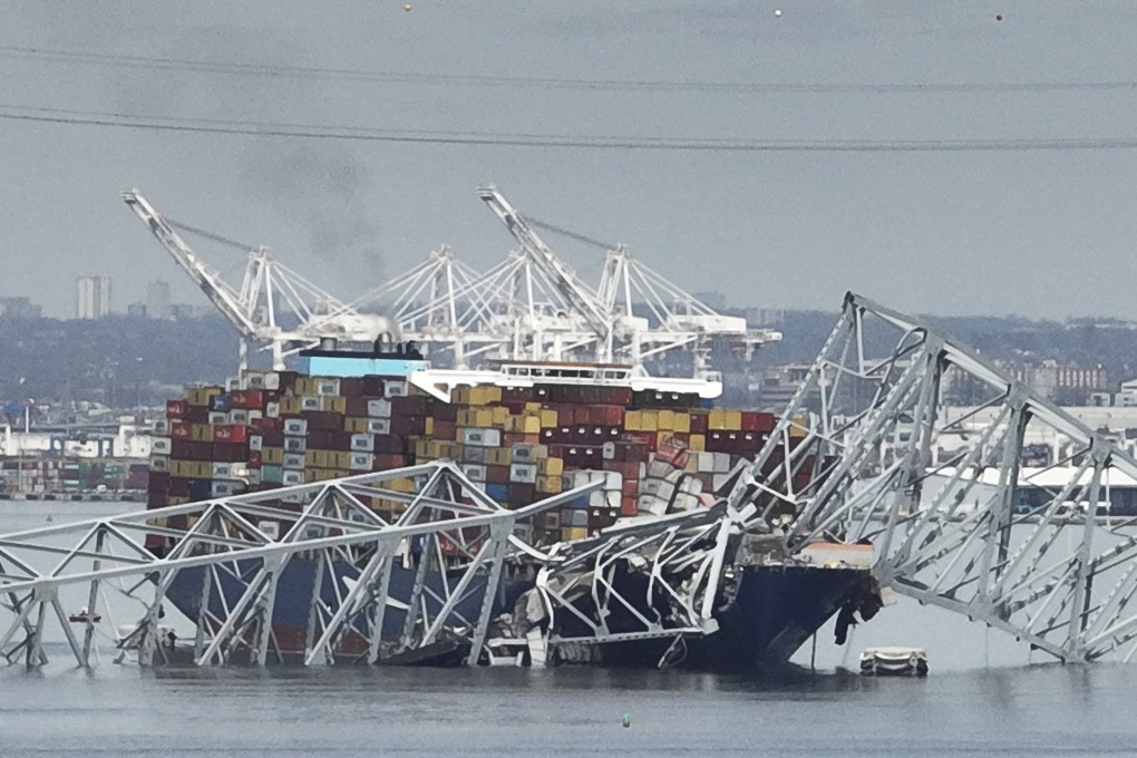 A cargo ship stuck under the Francis Scott Key Bridge after the ship hit the bridge on Tuesday in Baltimore, Maryland, US. Photo: AP