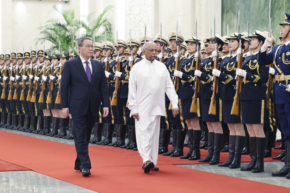 Chinese Premier Li Qiang holds a welcome ceremony for Sri Lankan Prime Minister Dinesh Gunawardena (right) in Beijing on March 26. Photo: Xinhua