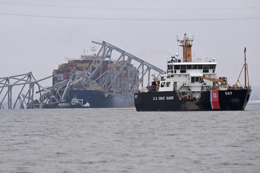 The US coastguard cutter Frank Drew (right) patrols near the collapsed Francis Scott Key Bridge after it was struck by a container ship in Baltimore, Maryland, on March 27. Photo: AFP
