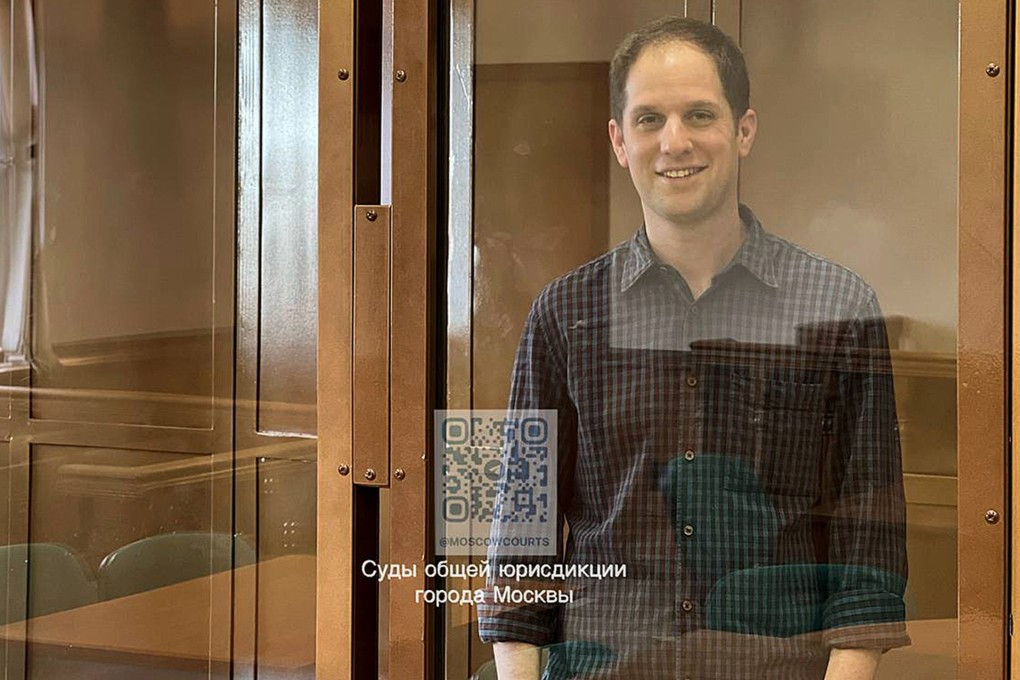Wall Street Journal reporter Evan Gershkovich stands in a glass cage in a courtroom at the Moscow City Court in Moscow, Russia on Tuesday. Photo: Moscow City Court Press Service via AP