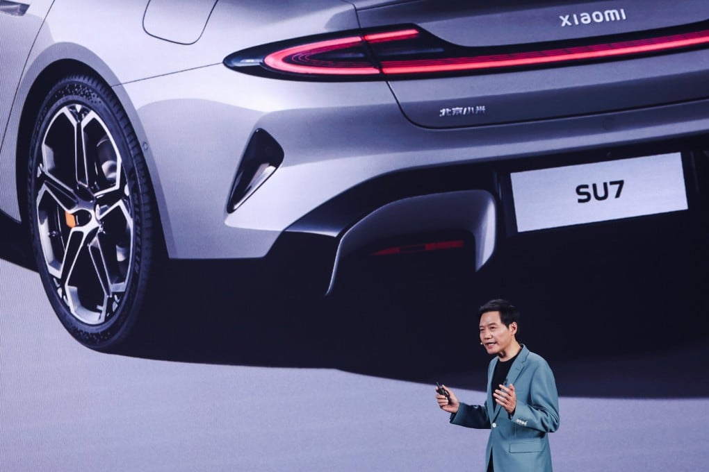 Lei Jun, founder and CEO of Xiaomi, speaks during the SU7 electric car launch ceremony in Beijing on Thursday. Photo: EPA-EFE