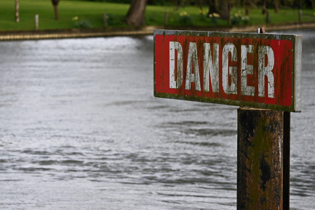 A “Danger” sign is seen on the River Thames, on the day data revealed sewage spills into England’s rivers and seas by water companies more than doubled last year. Photo: Reuters