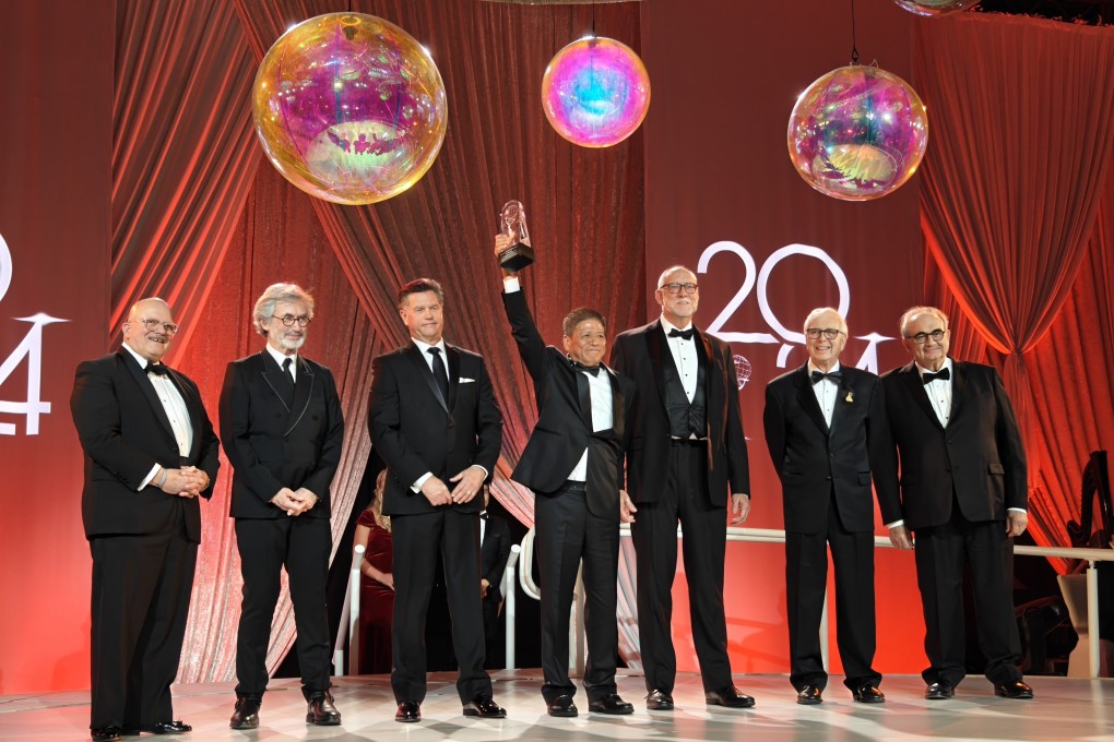 Su Zhigang (centre) with previous Lifetime of Distinguished Achievement award winners at the Themed Entertainment Association global summit last month.