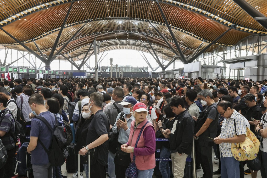 Travellers wait to cross into mainland China using the Hong Kong-Zhuhai-Macau Bridge. Photo: Edmond So
