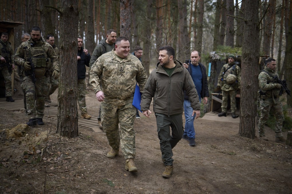 Ukrainian President Volodymyr Zelensky visits troops during a working visit to the Sumy region of Ukraine on Thursday. Photo: Presidential Press Service Handout / EPA-EFE