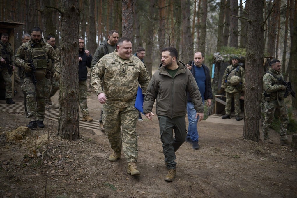 Ukrainian President Volodymyr Zelensky visits troops during a working visit to the Sumy region of Ukraine on Thursday. Photo: Presidential Press Service Handout / EPA-EFE