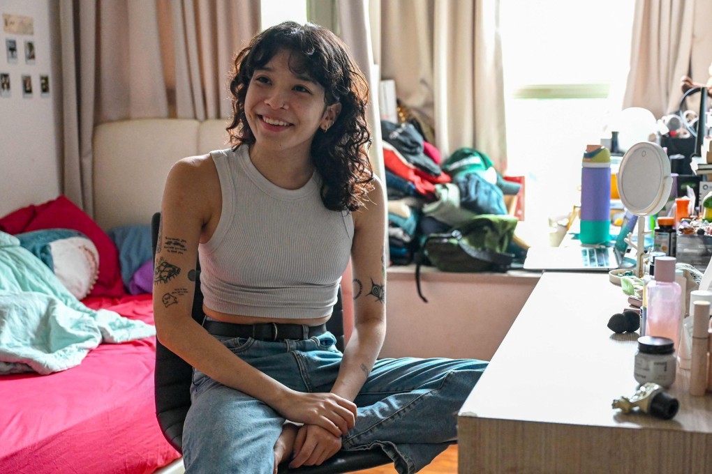 Medli Dorothea Loo gets ready at her home in Singapore. Photo: AFP