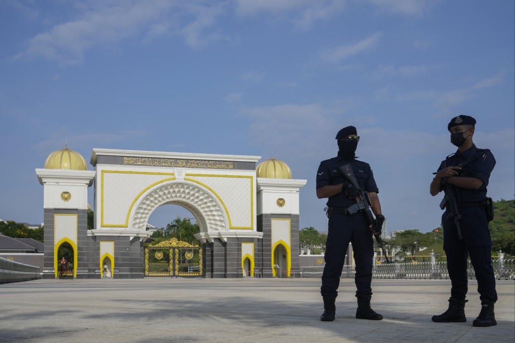 Police stand guard at the National Palace in Kuala Lumpur. Malaysia has arrested a suspected Israeli spy armed with handguns at a hotel in the capital. Photo: AP