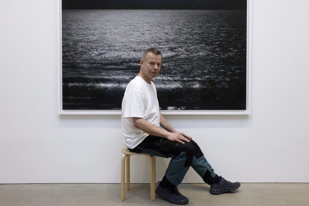 Wolfgang Tillmans with his artwork Lunar Landscape, part of The Point Is Matter at David Zwirner gallery in Central, his first solo exhibition in Hong Kong in six years. “What runs through this exhibition is a deep interest in the matter of things: this shirt, this branch, this leaf, this roadside, this ocean surface,” he says. Photo: Jonathan Wong