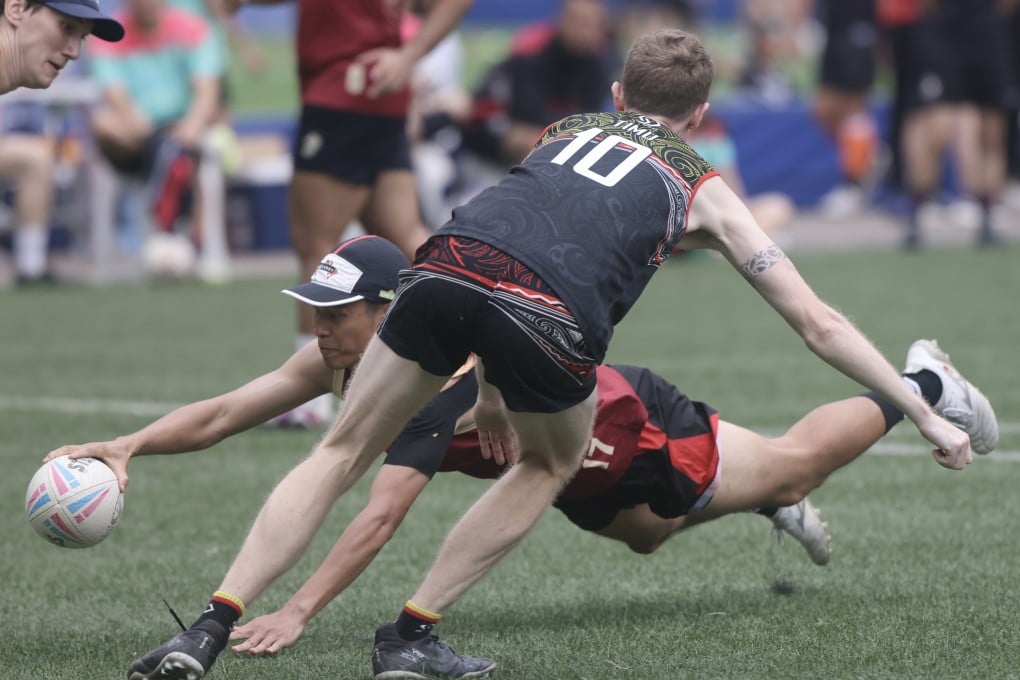 China Touch Development’s Zhong Junlong scores a try against Midas at Happy Valley Recreational Ground. Photo: Jonathan Wong