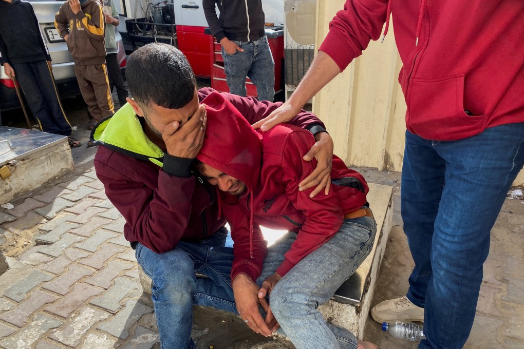 Mourners react on Sunday during the funeral of Palestinian aid truck driver Ismail Abed al-Daya, who health officials say was killed in an Israeli strike. Photo: Reuters