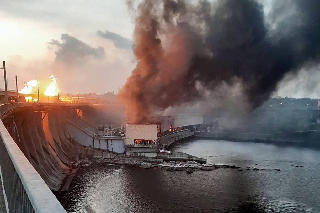 Smoke and fire rise over the dam of the Dnipro hydroelectric power plant after a missile attack in March in Zaporizhzhia, Ukraine. Photo: Prime Minister Denis Shmyhal’s office via AFP