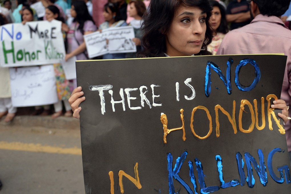 Pakistani activists hold placards during a protest in Islamabad on May 29, 2014. File photo: AFP