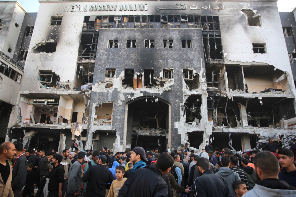 Palestinians inspect the damage outside Gaza’s al-Shifa hospital. Photo: AFP
