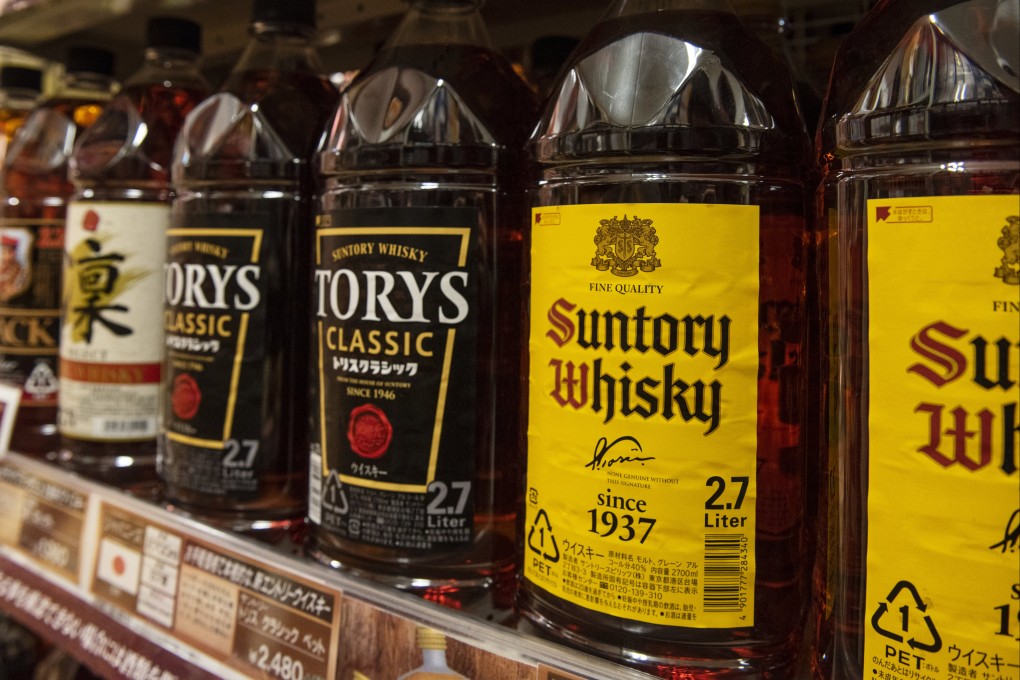 Japanese whiskies in a supermarket in Tokyo. Overseas demand has soared in recent years for the country’s acclaimed whiskies, sending prices sky-high, especially for the rarer aged varieties. Photo: Getty Images