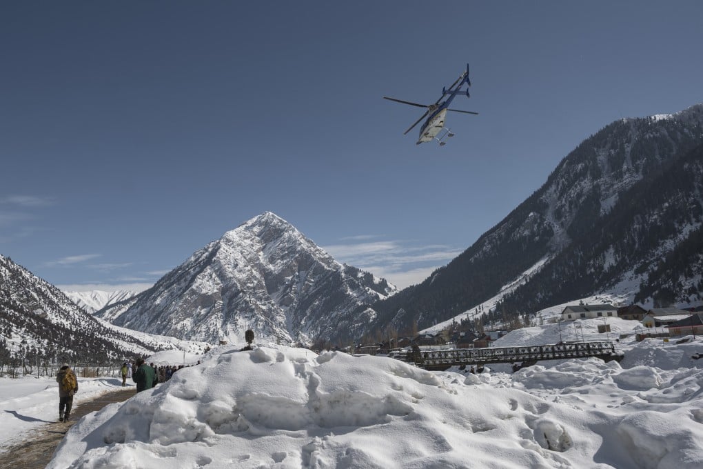 A helicopter comes in to land in the Gurez Valley in Indian Kashmir. Improved transport links and the arrival of the internet are changing the fortunes of the remote region. Photo: Umar Altaf