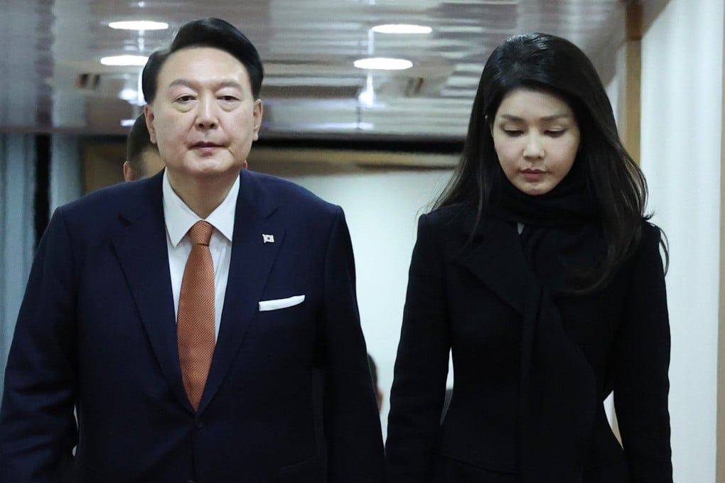 South Korean President Yoon Suk-yeol walks alongside his wife, Kim Keon Hee, as they arrive at Seoul Air Base on December 15 after finishing a four-day state visit to the Netherlands. Photo: Yonhap/via EPA-EFE