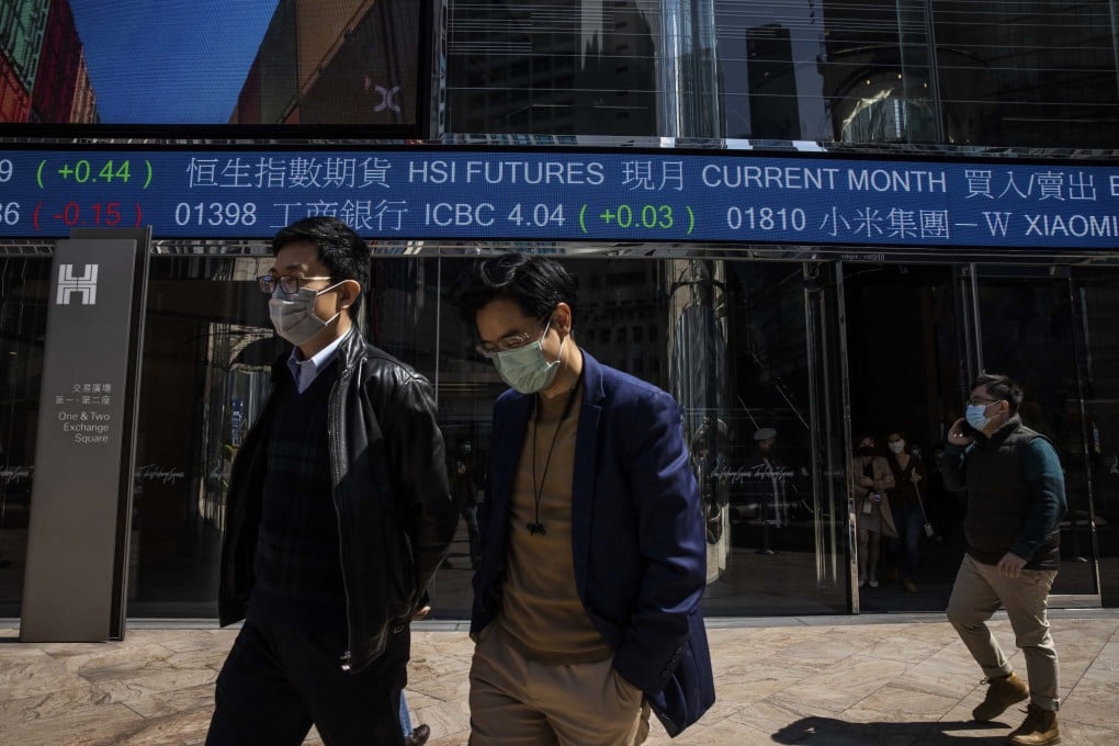 People walk through exchange square outside the Hong Kong Stock Exchange in Hong Kong. Photo: AFP