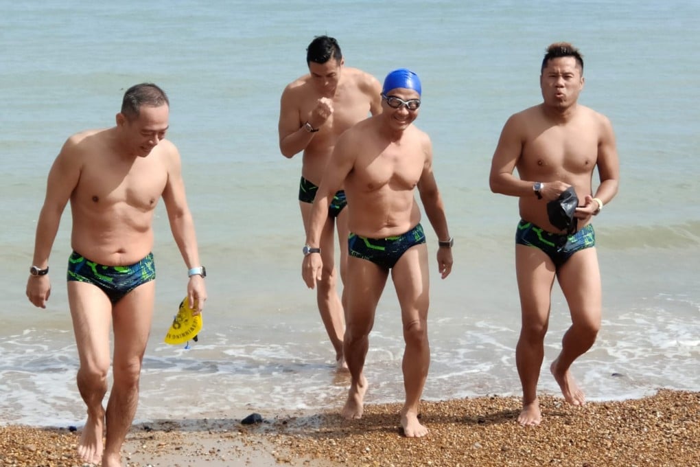 Ng Chee Soon (with blue cap) with his Singaporean relay team members (from left) Lim Chee Kiong, Mark Tan and Alvin Tam after an open water training swim. The relay team was the first from Singapore to swim across the English Channel. Photo: Ng Chee Soon
