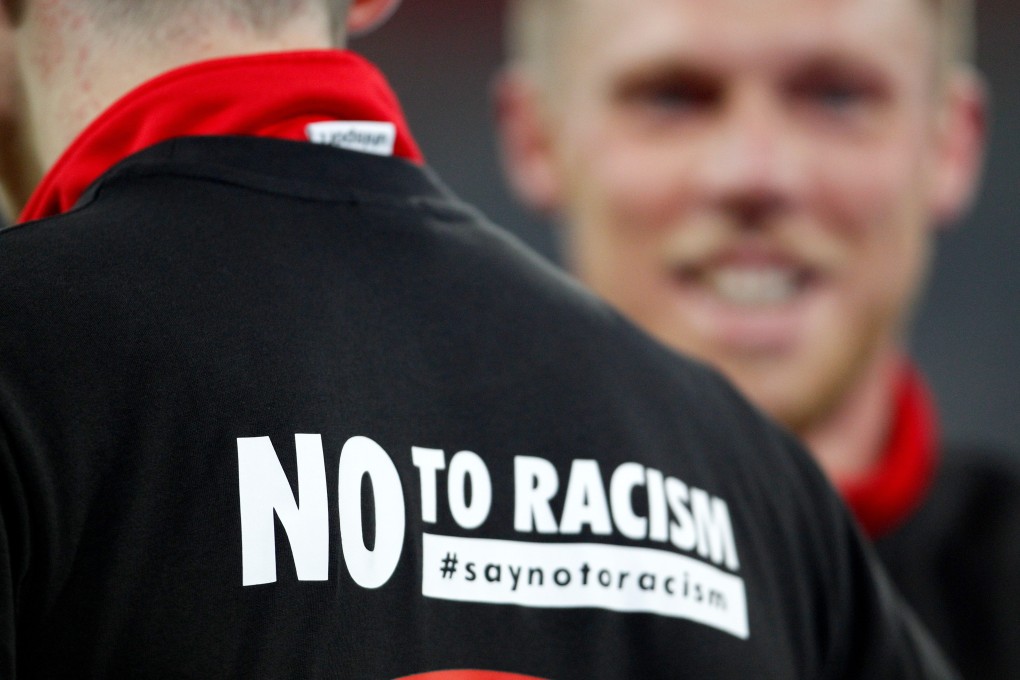 The message “No to Racism” is written on the warm-up shirt of a Düsseldorf player ahead of the German 2nd Bundesliga match between Fortuna Duesseldorf and VfL Bochum at the Merkur Spiel-Arena. Photo: DPA