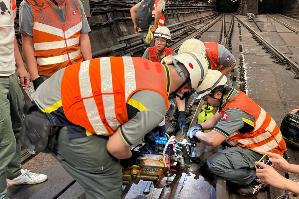 MTR workers carry out temporary repairs on the tracks on Thursday morning. Photo: MTR