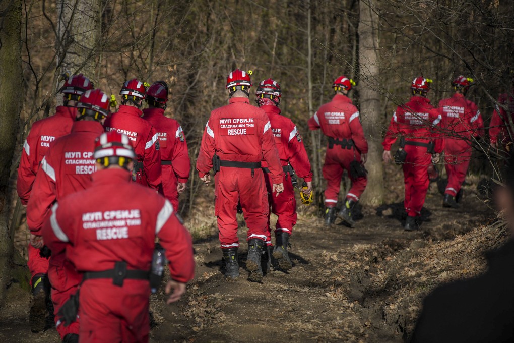 The Serbian police rescue team search a forest near Bor. Serbian police have arrested two men suspected of killing a 2-year-old girl whose disappearance last month gripped the nation. Photo: AP