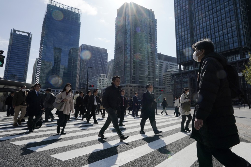 People walk in a crosswalk in Tokyo on March 7, 2024. Photo: EPA-EFE