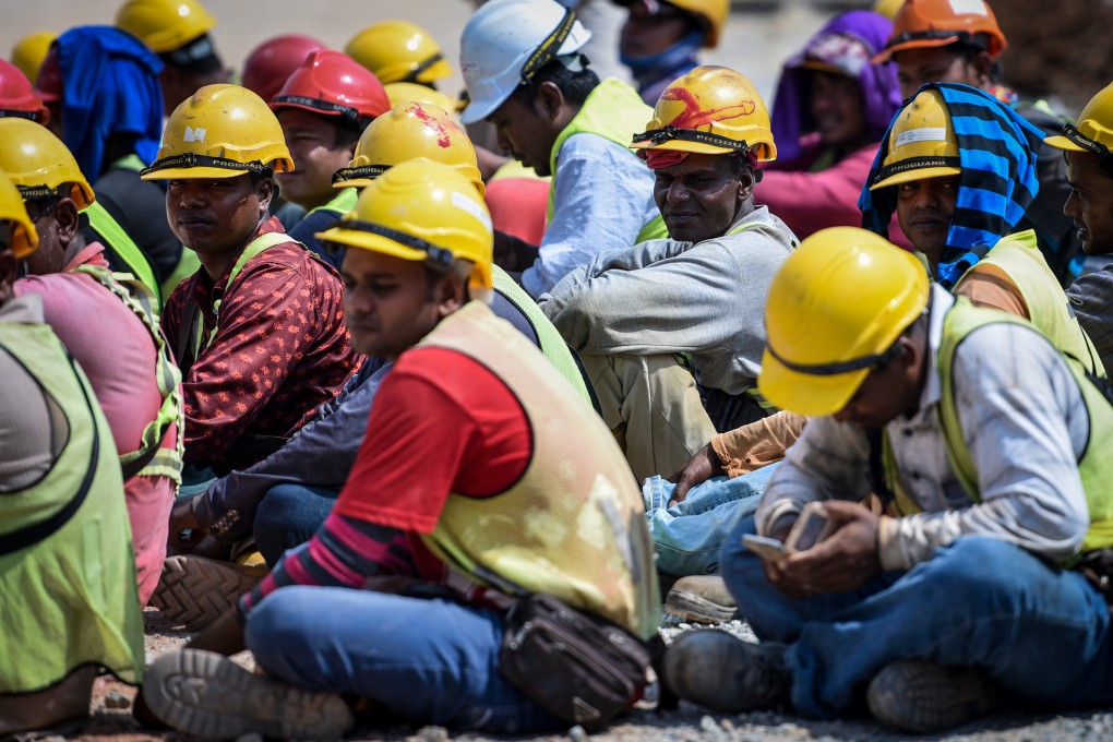 Migrant workers from Bangladesh are seen being arrested by Malaysian immigration authorities during a raid in Kuala Lumpur. Photo: Shutterstock