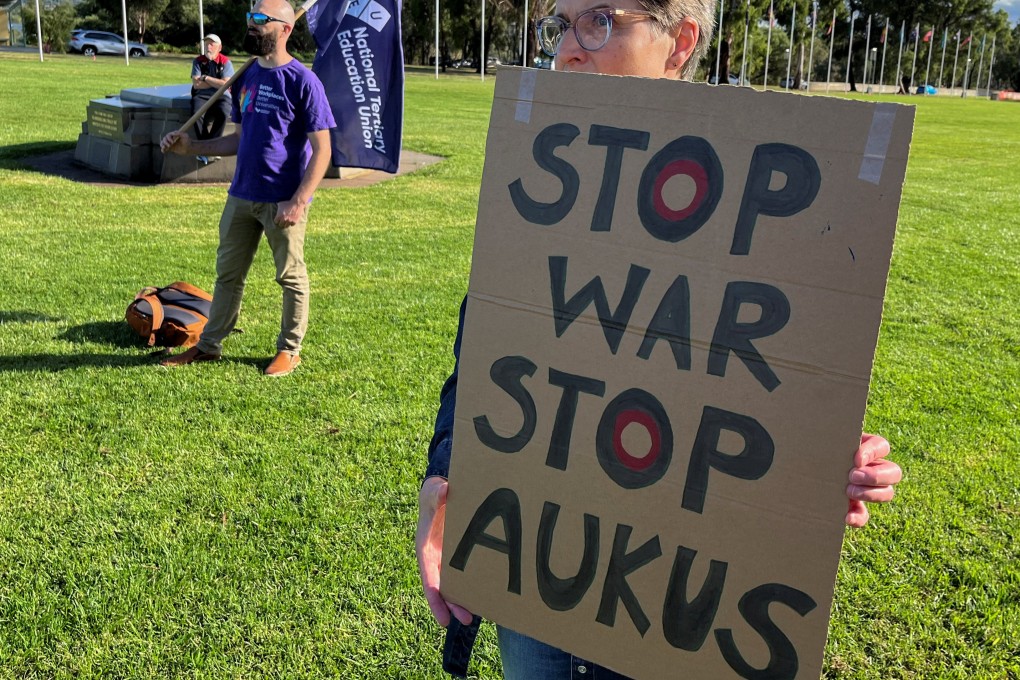 Anti-Aukus protesters stand outside Australia’s parliament, in Canberra, March 18, 2024. Photo: Reuters