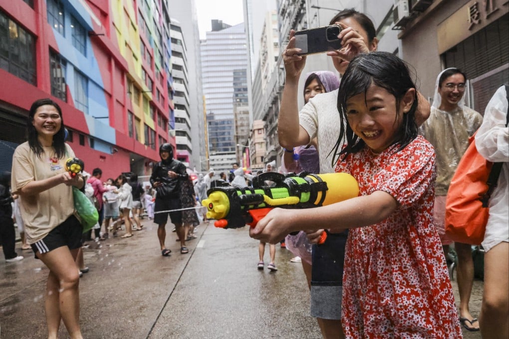 A youngster makes a splash in Lai Chi Kok on Saturday. Photo: Dickson Lee