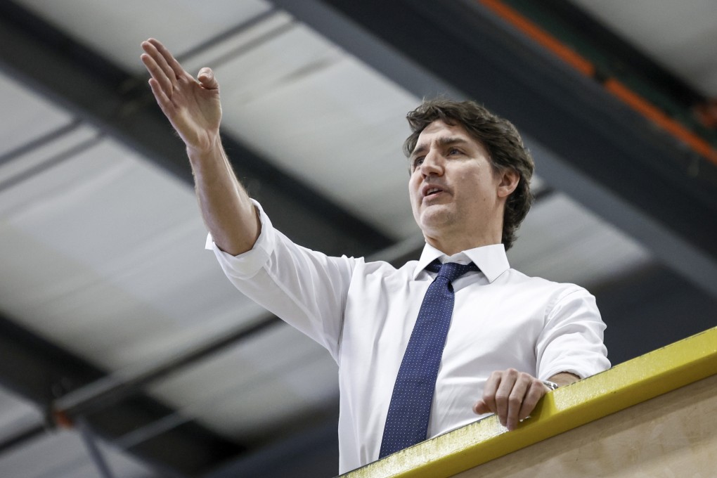 Canadian Prime Minister Justin Trudeau tours a modular home construction facility before making a housing announcement in Calgary, Alberta, on Friday. Photo: Canadian Press via AP