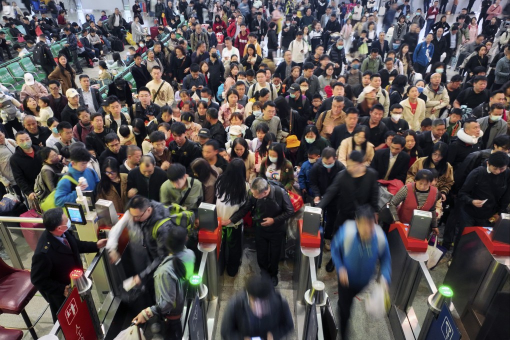Drone photo shows travellers going through automated gateways at a railway station in Hengyang, in central China’s Hunan province on Saturday. Photo: Xinhua